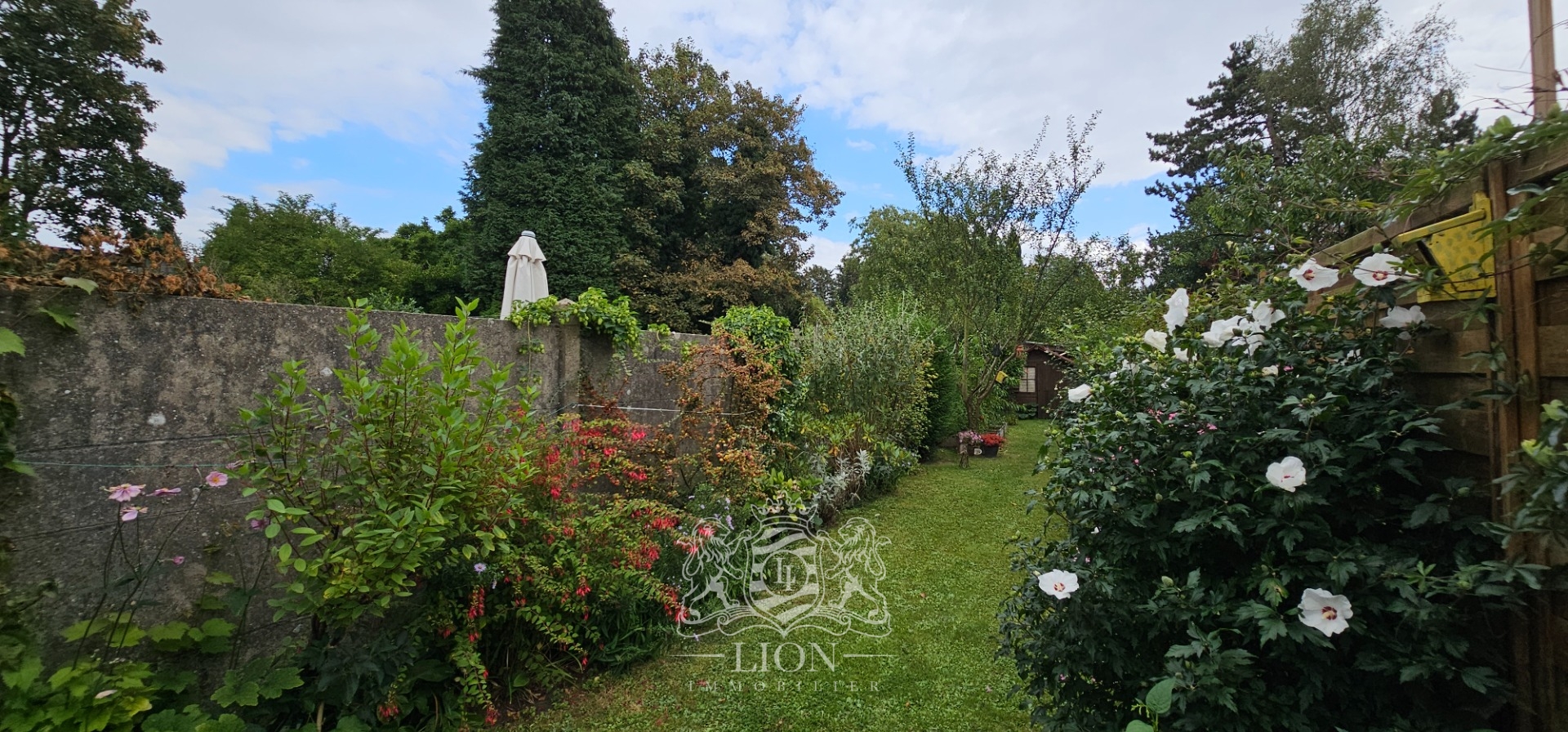 Coquette maison avec un beau jardin verdoyant Photo 10 - Le Lion Immobilier