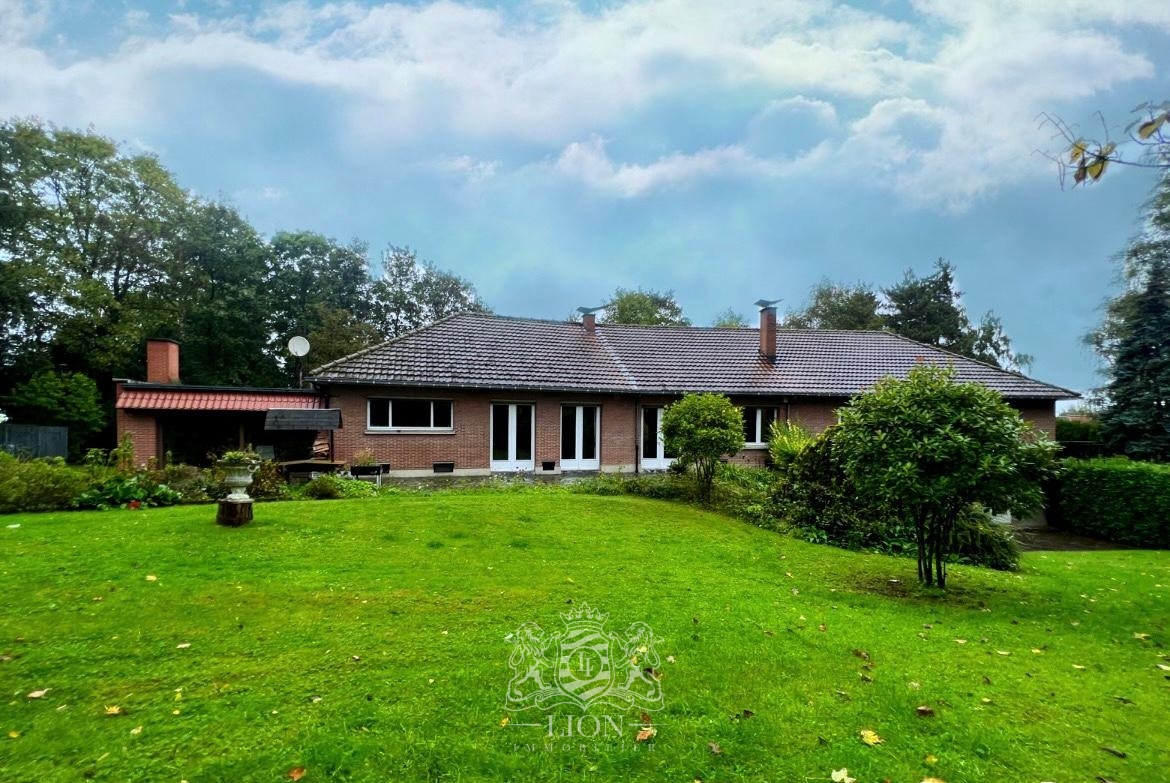 Plain pied dans un ecrin de verdure Photo 1 - Le Lion Immobilier